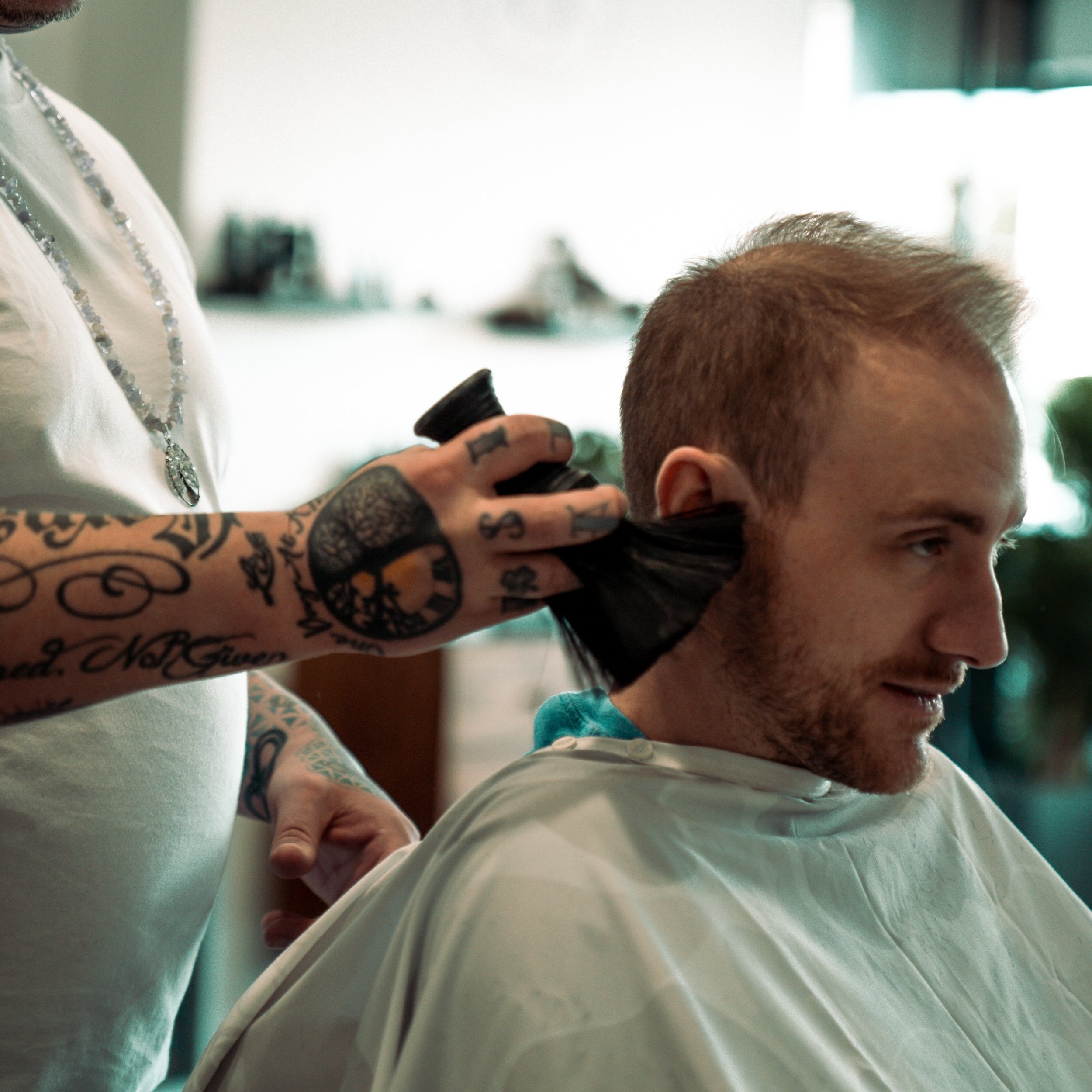 A haircut in progress at The Presidential Parlour
